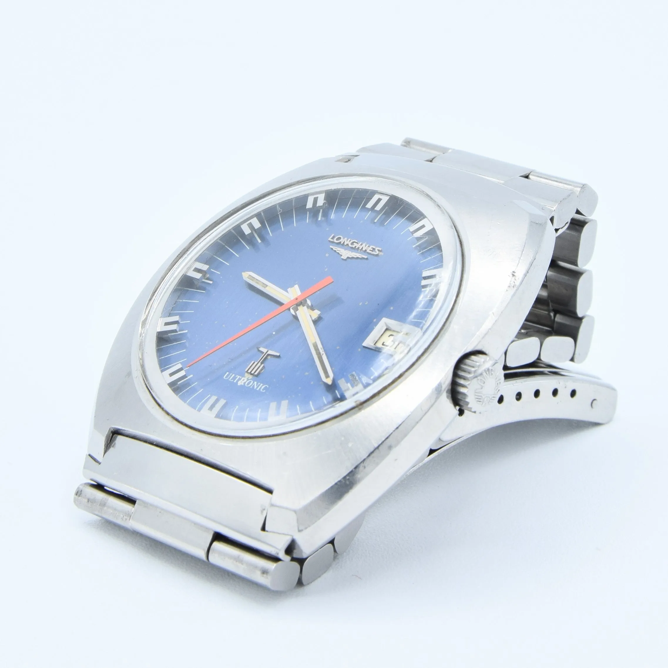 1976 Longines Large Ultronic Date Tonneau Wristwatch with Electric Blue Dial Model 8479 in Stainless Steel Case on Bracelet with Box